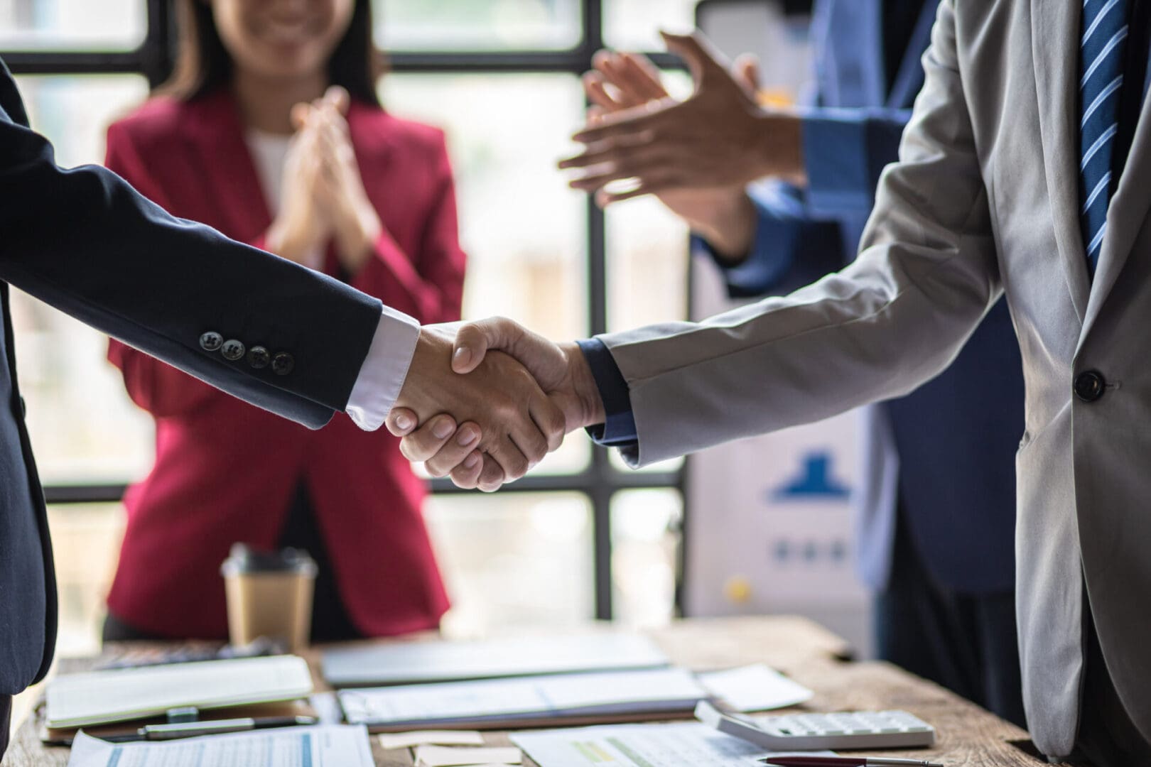 Business people shaking hands in agreement.